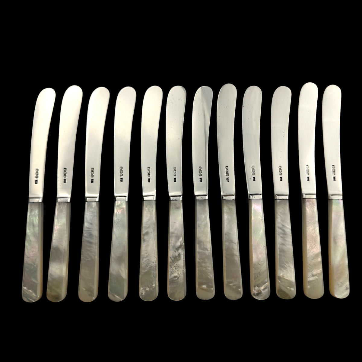 Set of 12 Sterling Silver and Mother of Pearl Butter Knives, 1926