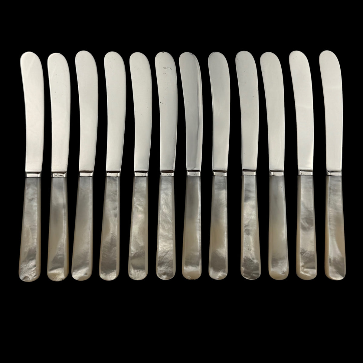 Set of 12 Sterling Silver and Mother of Pearl Butter Knives, 1926