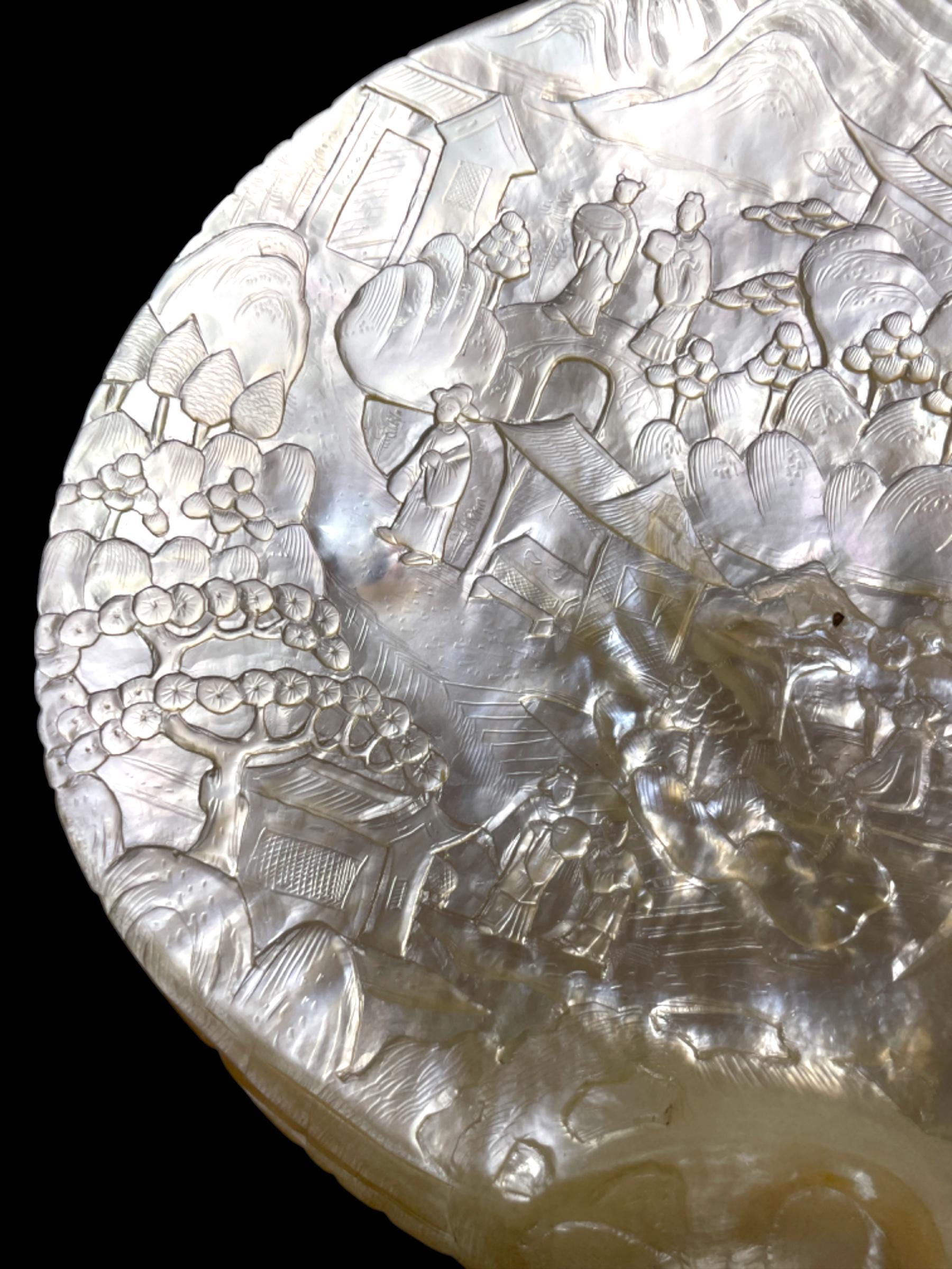 A Qing Dynasty (Late 1800s) Hand-Carved Pearl Shell. With stand.
