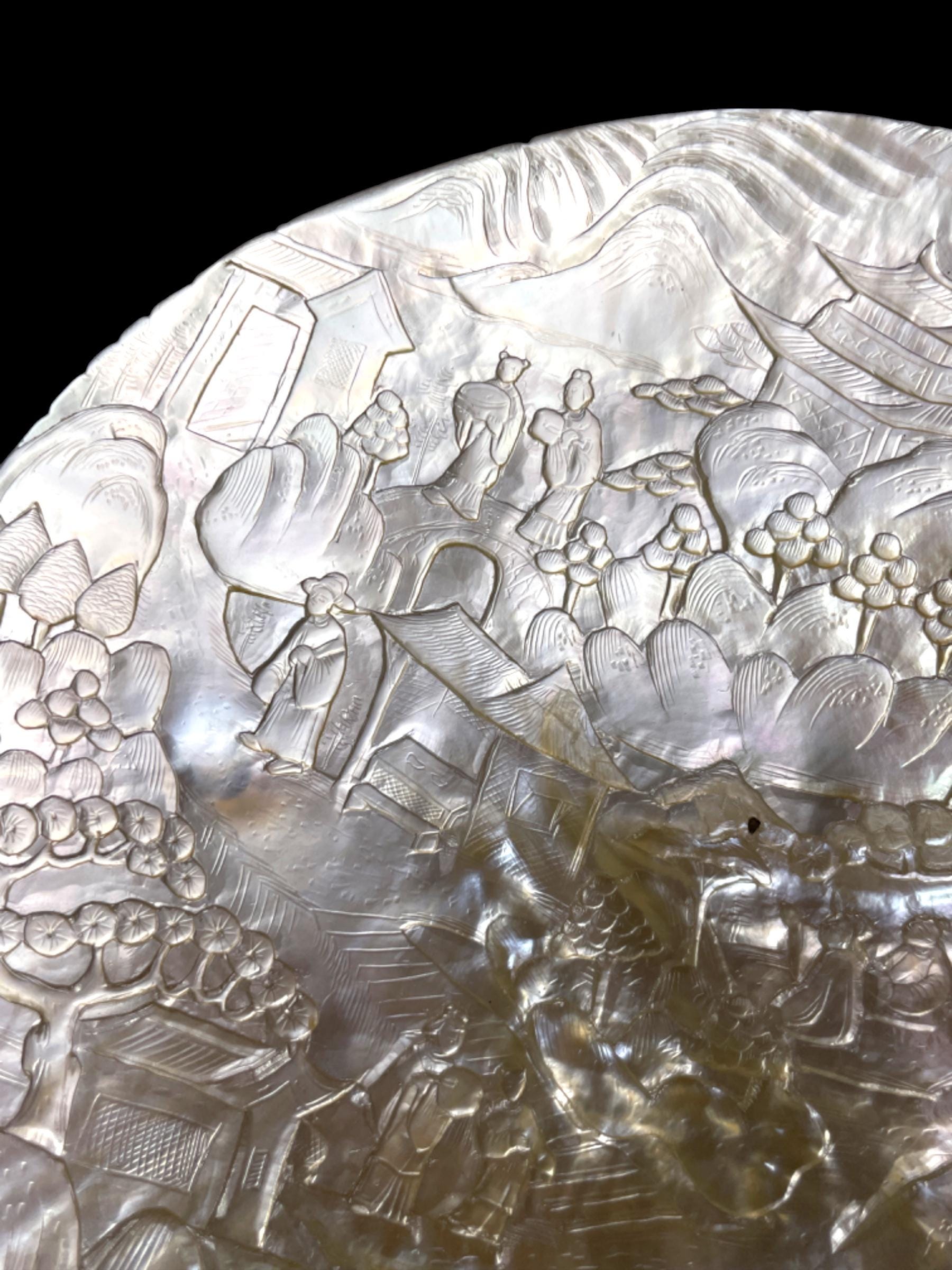 A Qing Dynasty (Late 1800s) Hand-Carved Pearl Shell. With stand.