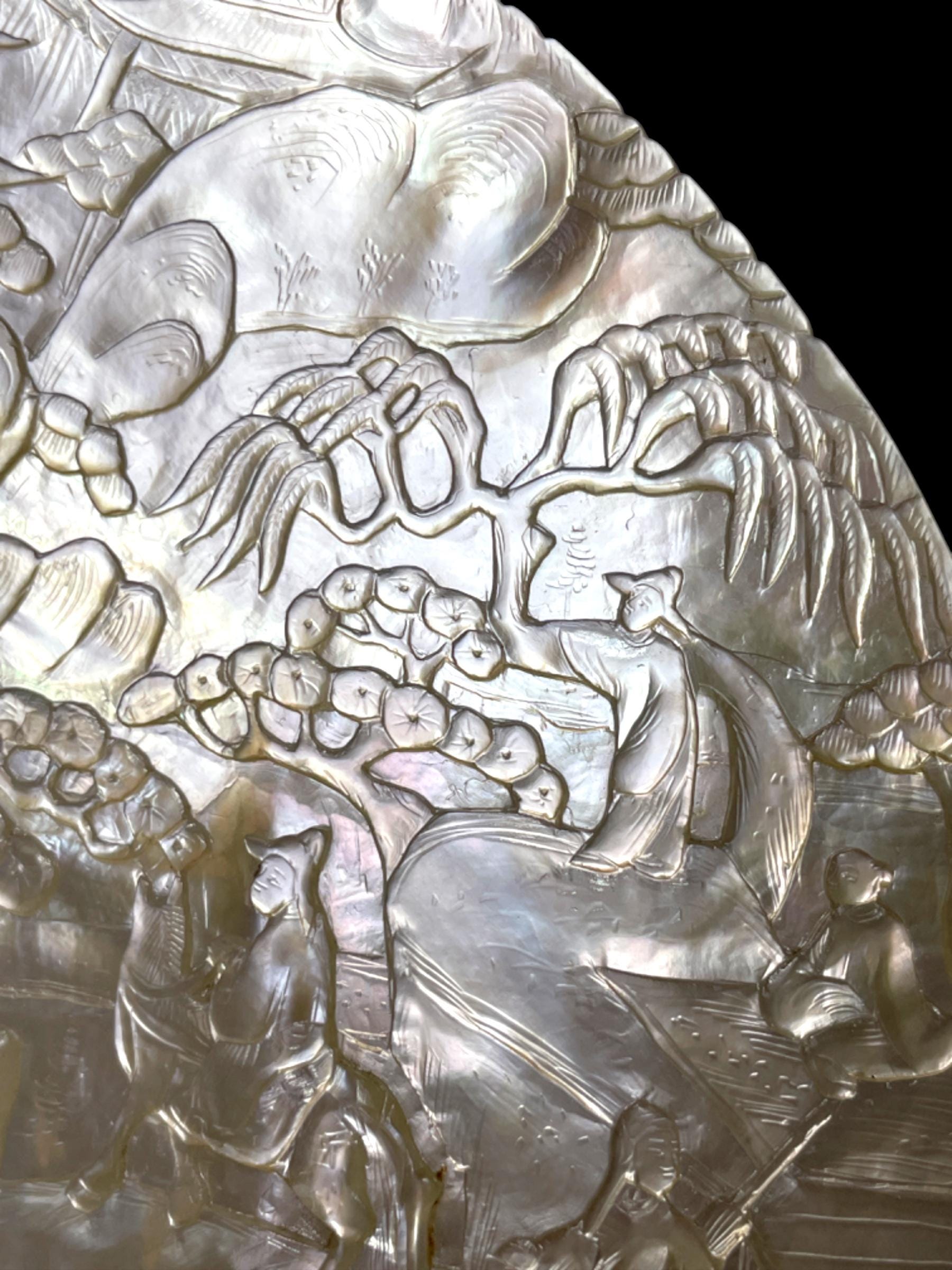 A Qing Dynasty (Late 1800s) Hand-Carved Pearl Shell. With stand.