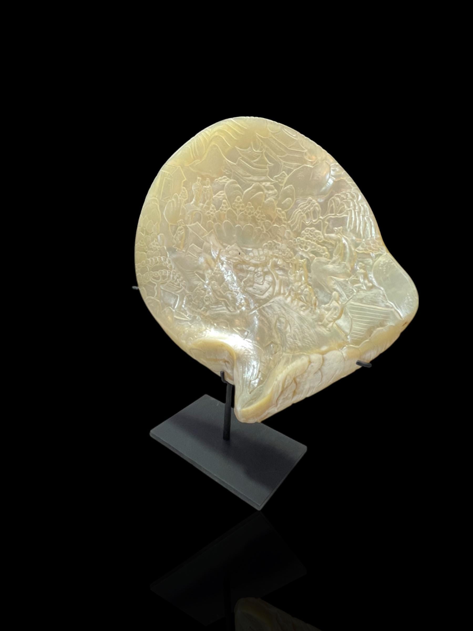 A Qing Dynasty (Late 1800s) Hand-Carved Pearl Shell. With stand.